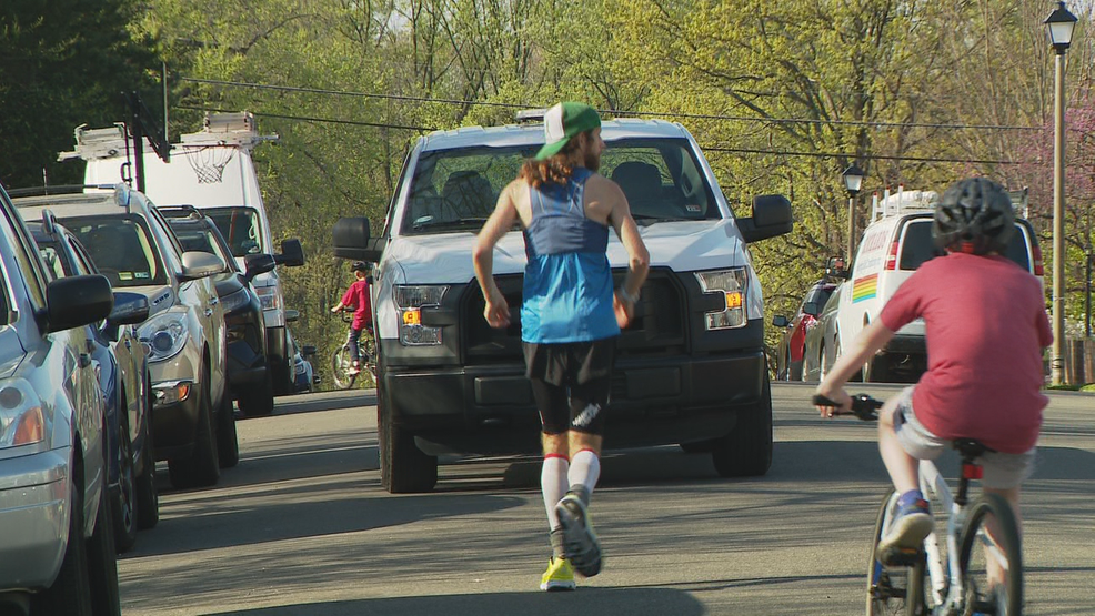 Man running marathon in his neighborhood