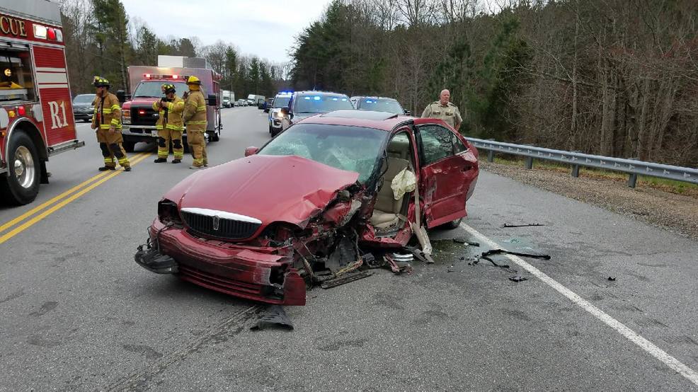 Firefighters free person trapped in wrecked car after crash in