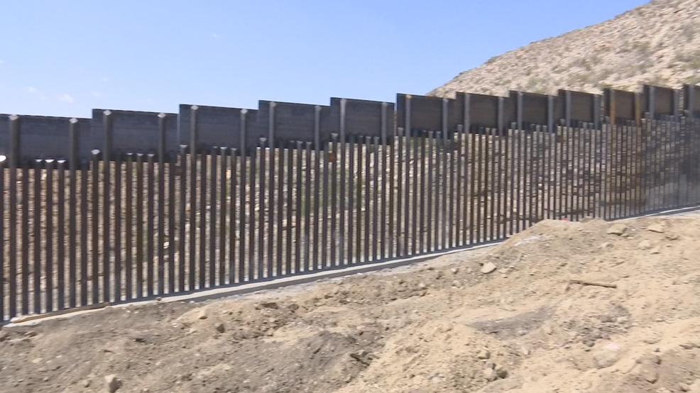 Owner of land where private wall is built charged with building without