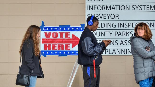 Reports of long lines, broken machines as voters go to polls